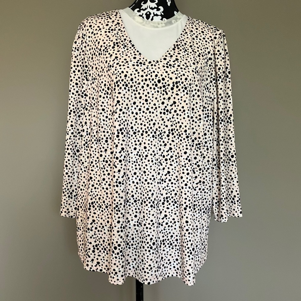 Fun animal print blouse with V neckline and three quarter sleeves.